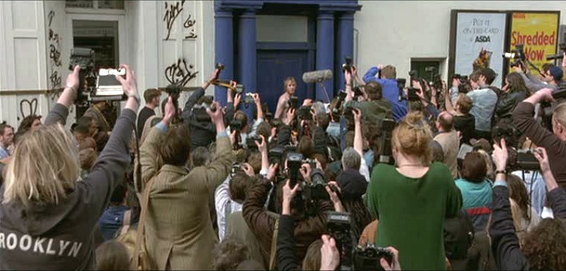 Rhys Ifans poses in underwear outside blue door "Notting Hill"