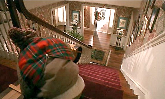 Kevin sledding downstairs in Home Alone movie