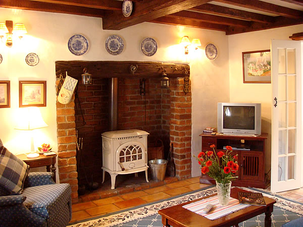 A living room filled with furniture and a fire place