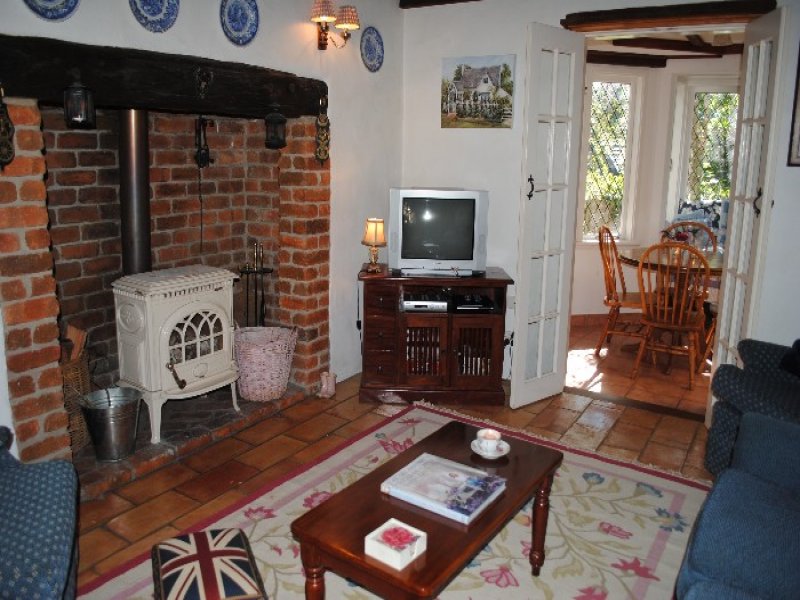 A living room filled with furniture and a fire place