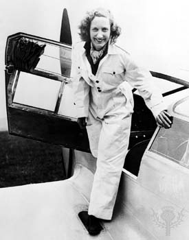 old black and white photo of Beryl Markham climbing out of plane