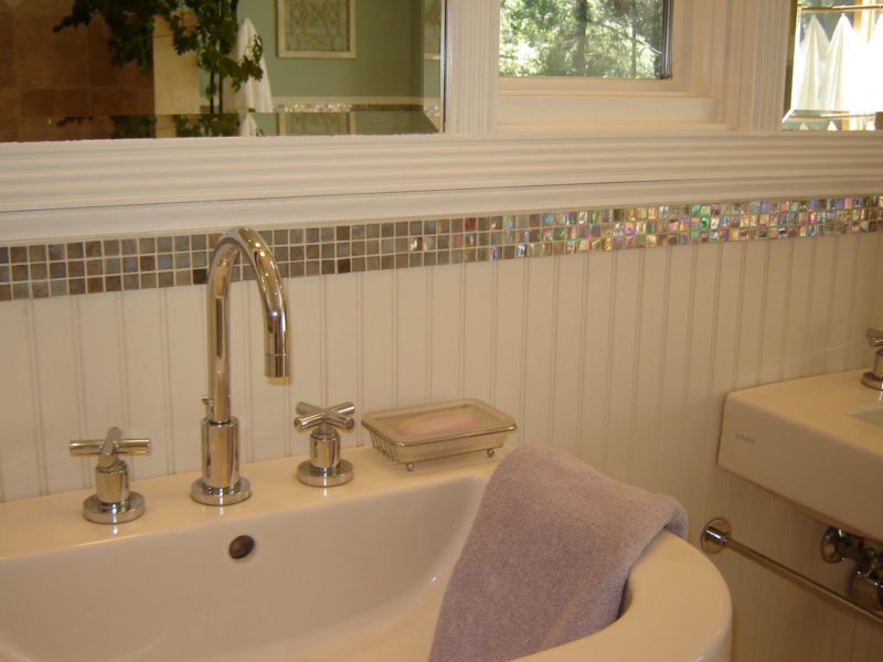 close-up of sink detail and glass tiles