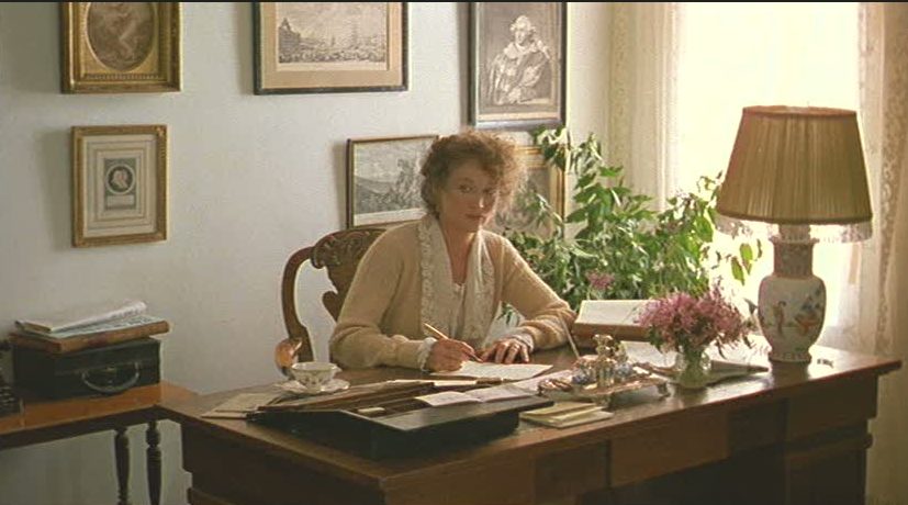 Meryl Streep sits at desk