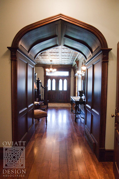 hallway leading to double front doors of house