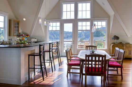 A dining room table in front of a window