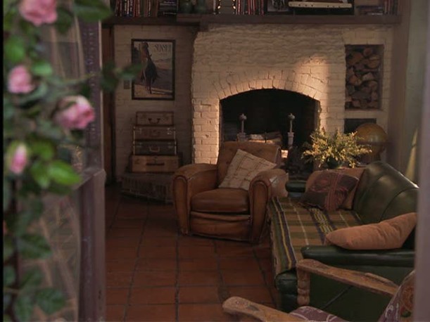 A living room filled with furniture and a fire place