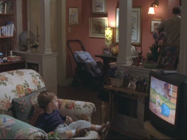 toddler sitting in armchair in Sookie\'s living room