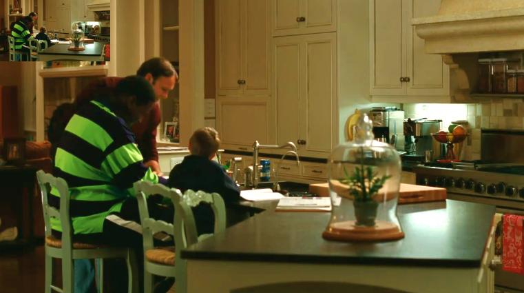 family sitting at kitchen island