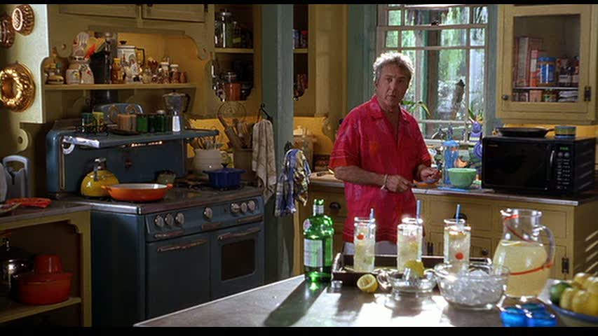 A person sitting on a kitchen counter