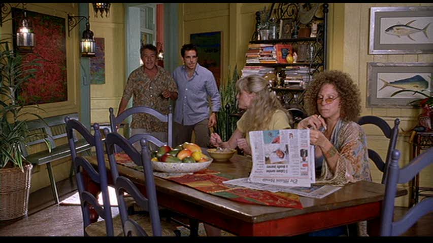 A group of people sitting at a table eating food