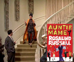 Auntie Mame coming down the staircase with movie poster inset