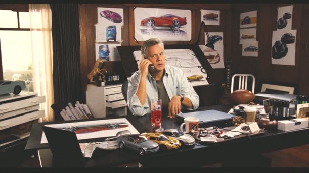 Tim Robbins sitting at a desk in Zathura movie