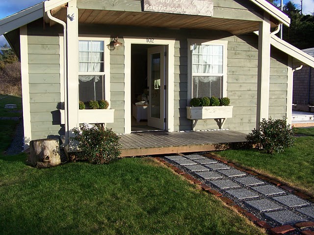 front exterior of small beach house with small porch