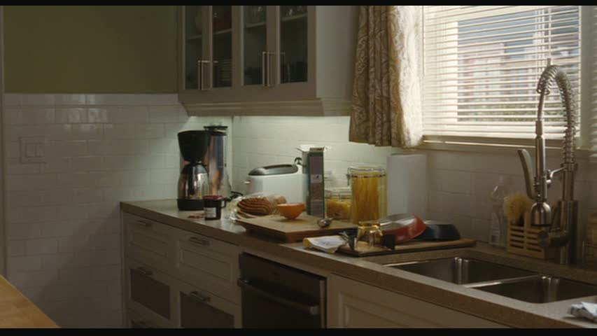 A kitchen with a sink and a window