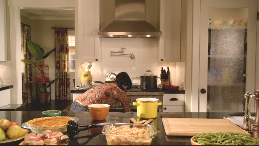 Jules cooking in her kitchen