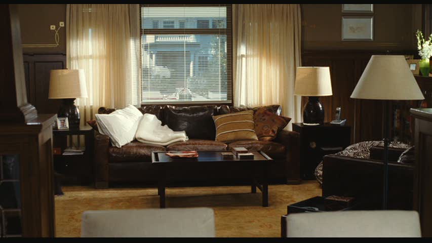 A living room filled with furniture and a large window