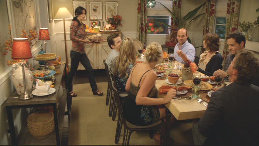 A group of people sitting at a table for Thanksgiving