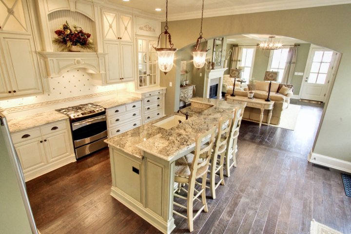 A kitchen with a wood floor