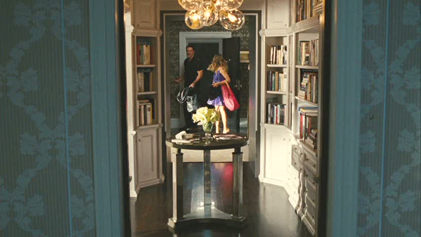 book lined hallway in apartment