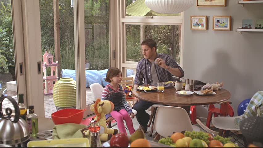 dad and daughter sitting at kitchen table