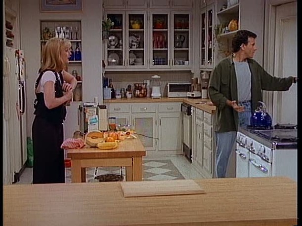 Jamie and Paul standing in their apartment kitchen