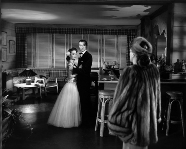 Veda and Monte embracing in the beach house in Mildred Pierce movie