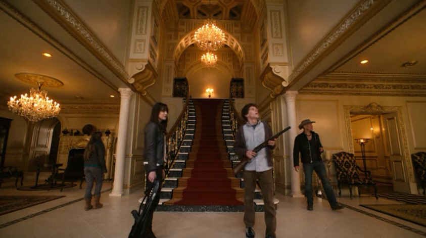 scene from Zombieland movie with grand staircase in background