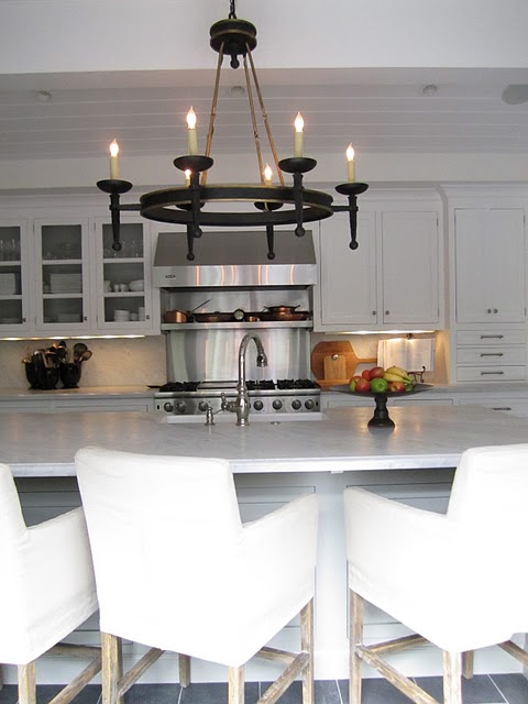 white kitchen with marble island