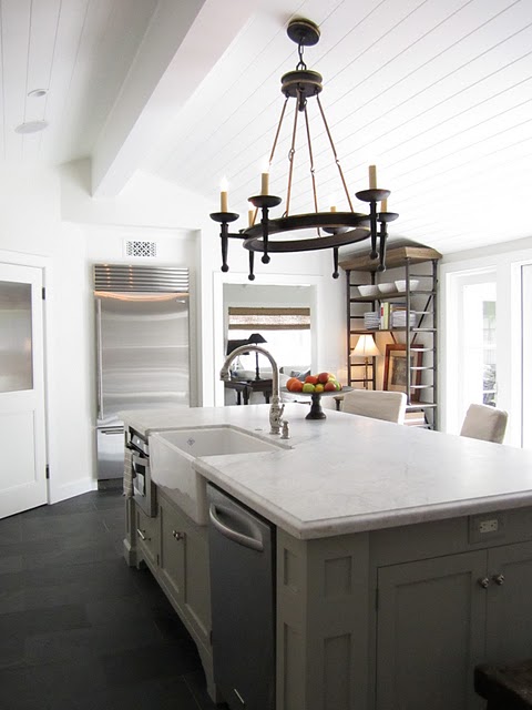 white kitchen with marble island from opposite angle