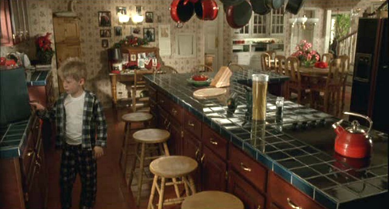 Kevin in the green and red Home Alone kitchen