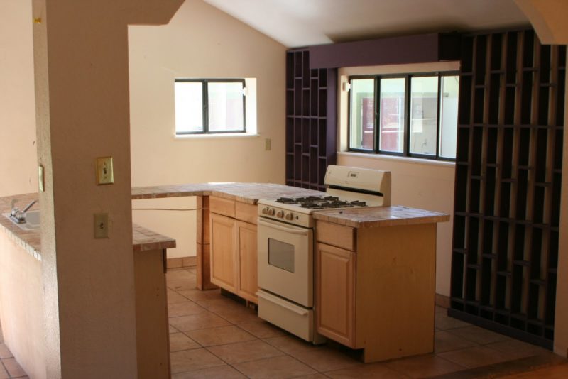 A kitchen with a sink and a window