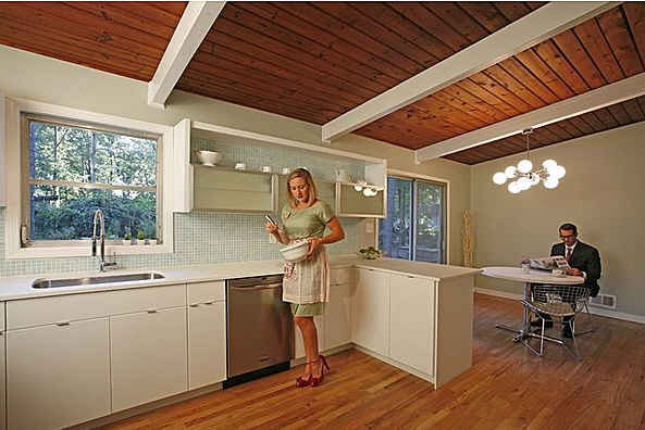 woman cooking in midcentury modern kitchen