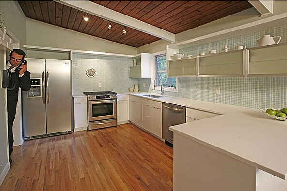 A large kitchen with stainless steel appliances