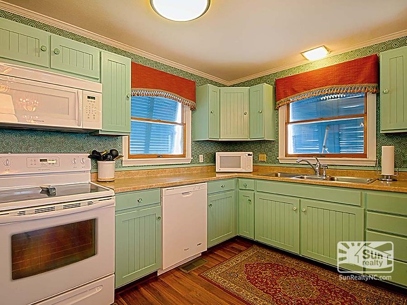 The inn\'s kitchen with painted cabinets