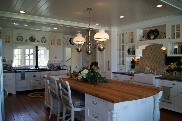 A kitchen with an island in the middle of a room