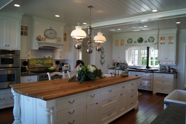 A kitchen with an island in the middle of a room