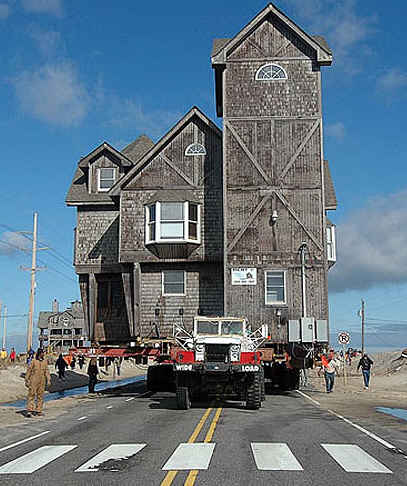 moving the house on the back of a truck to higher land