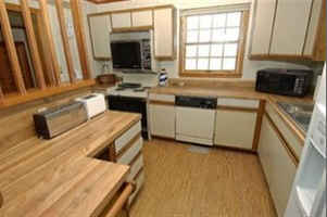 A kitchen with wooden cabinets before remodel