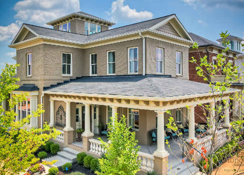 A house with bushes in front of a building