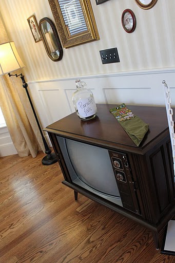 old console TV and penny jar in Up movie house replica