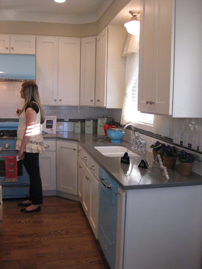 A woman standing in a kitchen