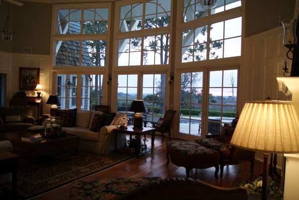 A living room filled with furniture and a large window