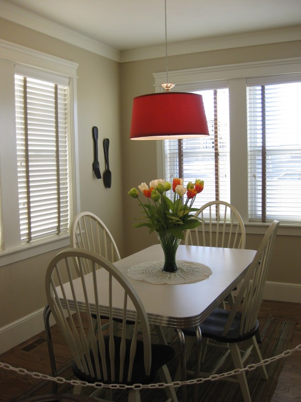 A dining room table in front of a window