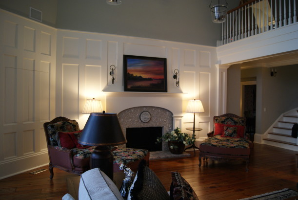 A living room filled with furniture and a fire place