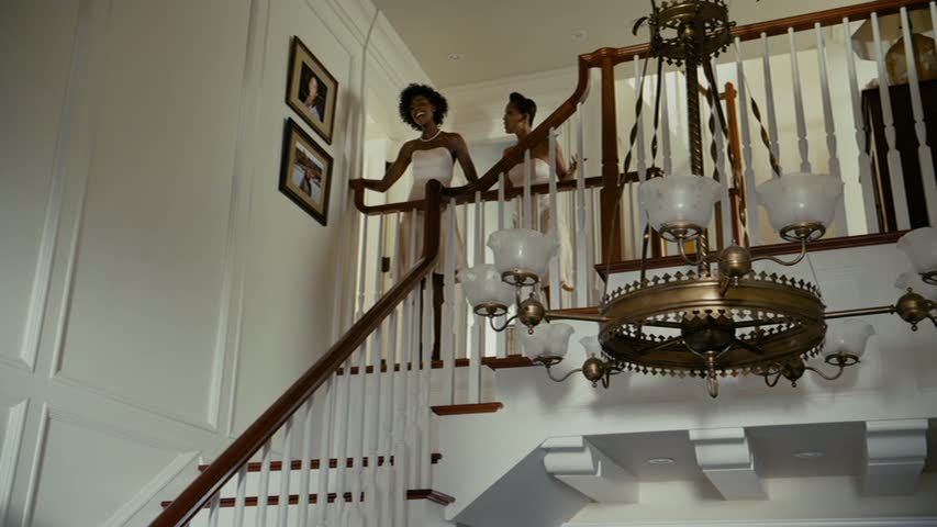 looking up the staircase from the entry hall