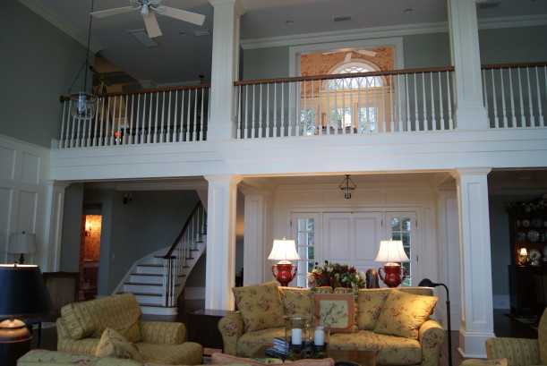 A two story living room with sofa