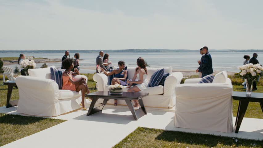 A group of people sitting at a beach