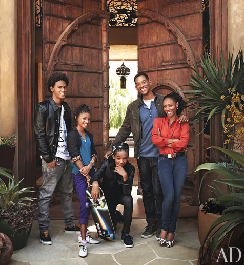 Will Smith and Jada Pinkett Smith with kids in front of their house