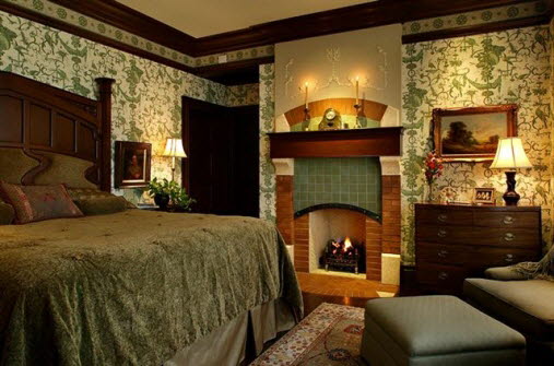 A bedroom with a bed and a fireplace