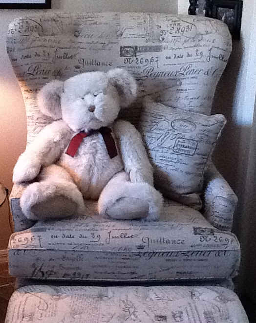 armchair with teddy bear sitting on it